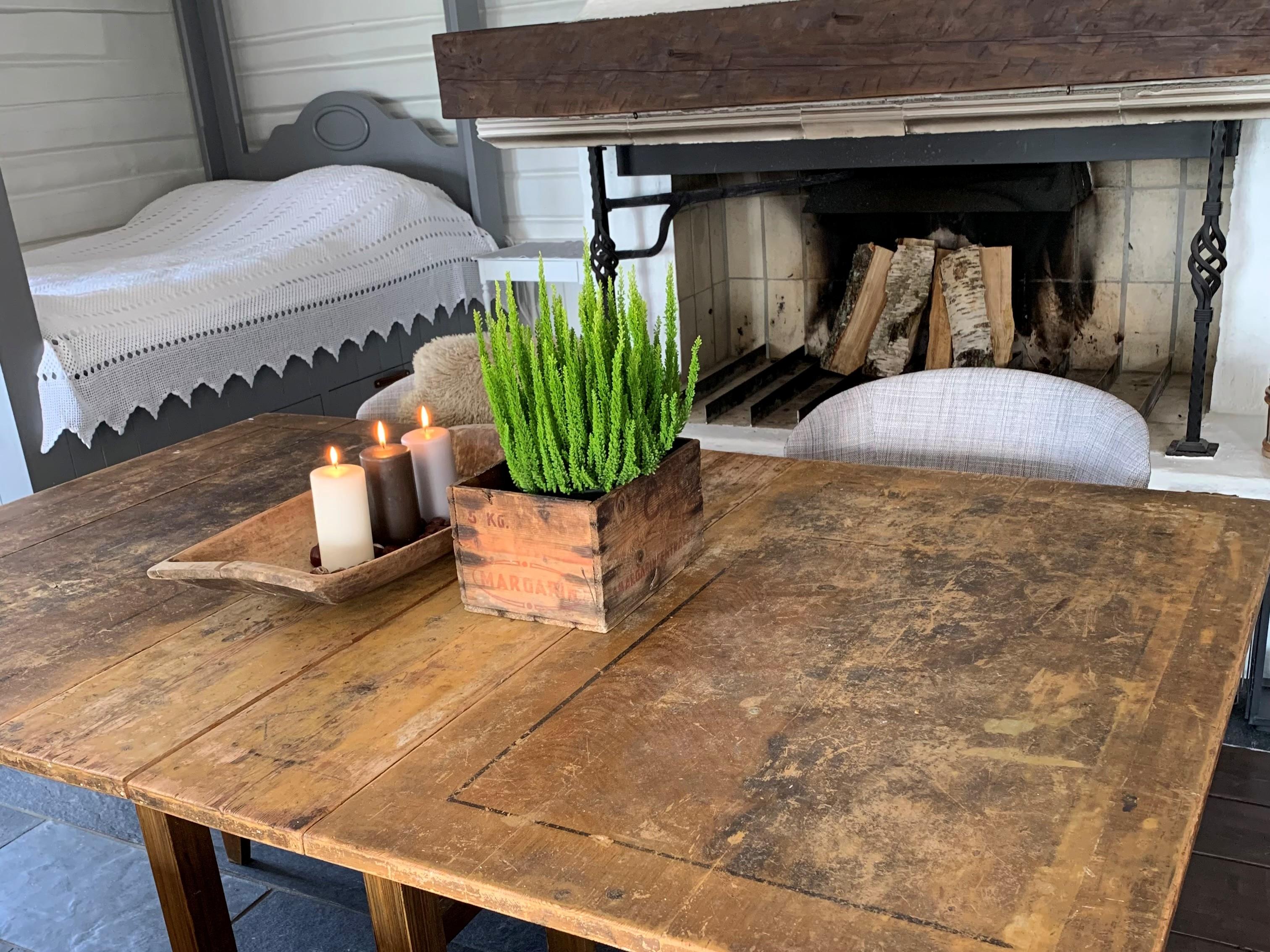 Old living room with bed and fireplace