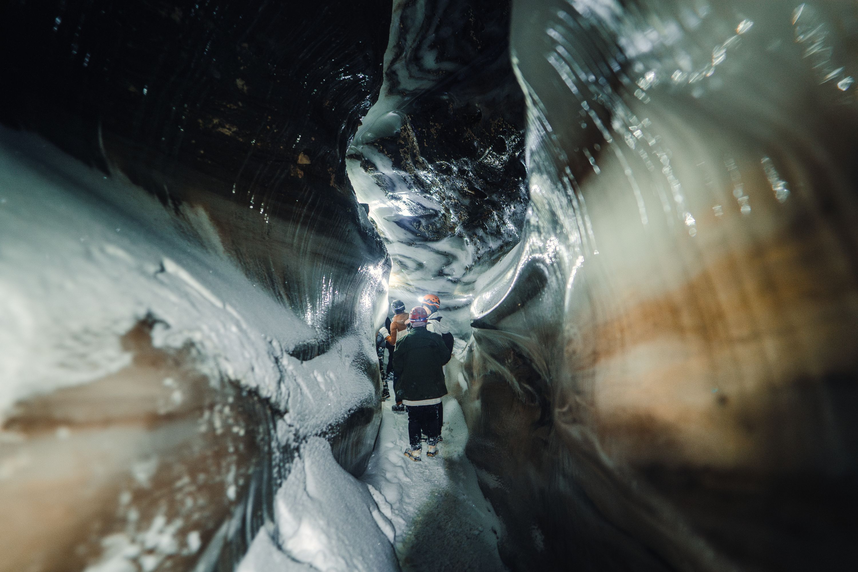 People walking in an ice cave