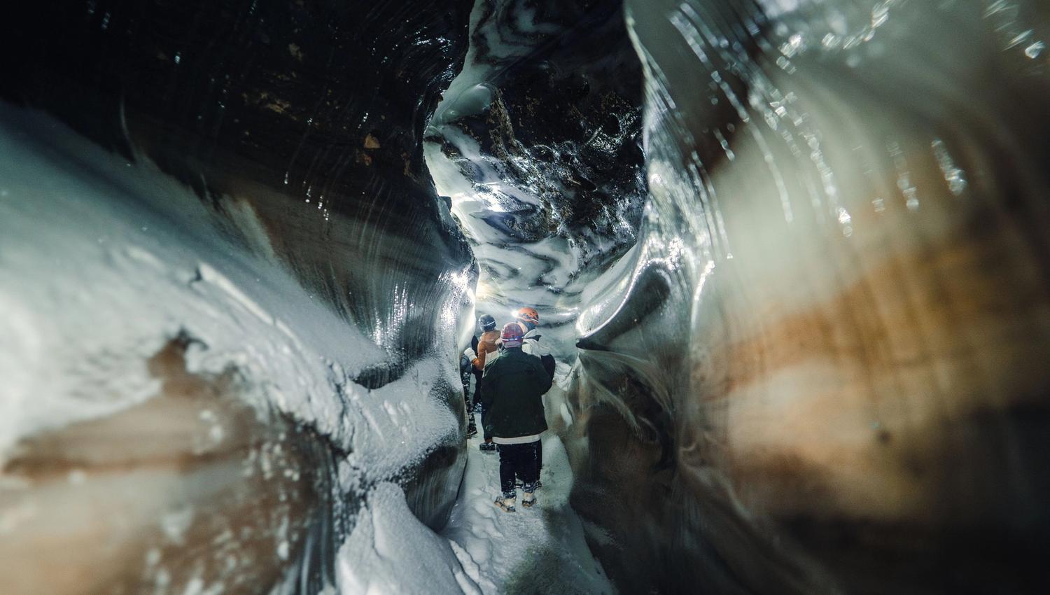 People walking in an ice cave