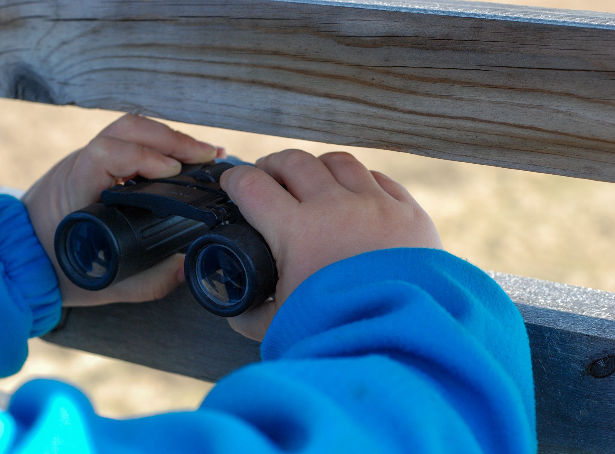 girl looking with binoculars