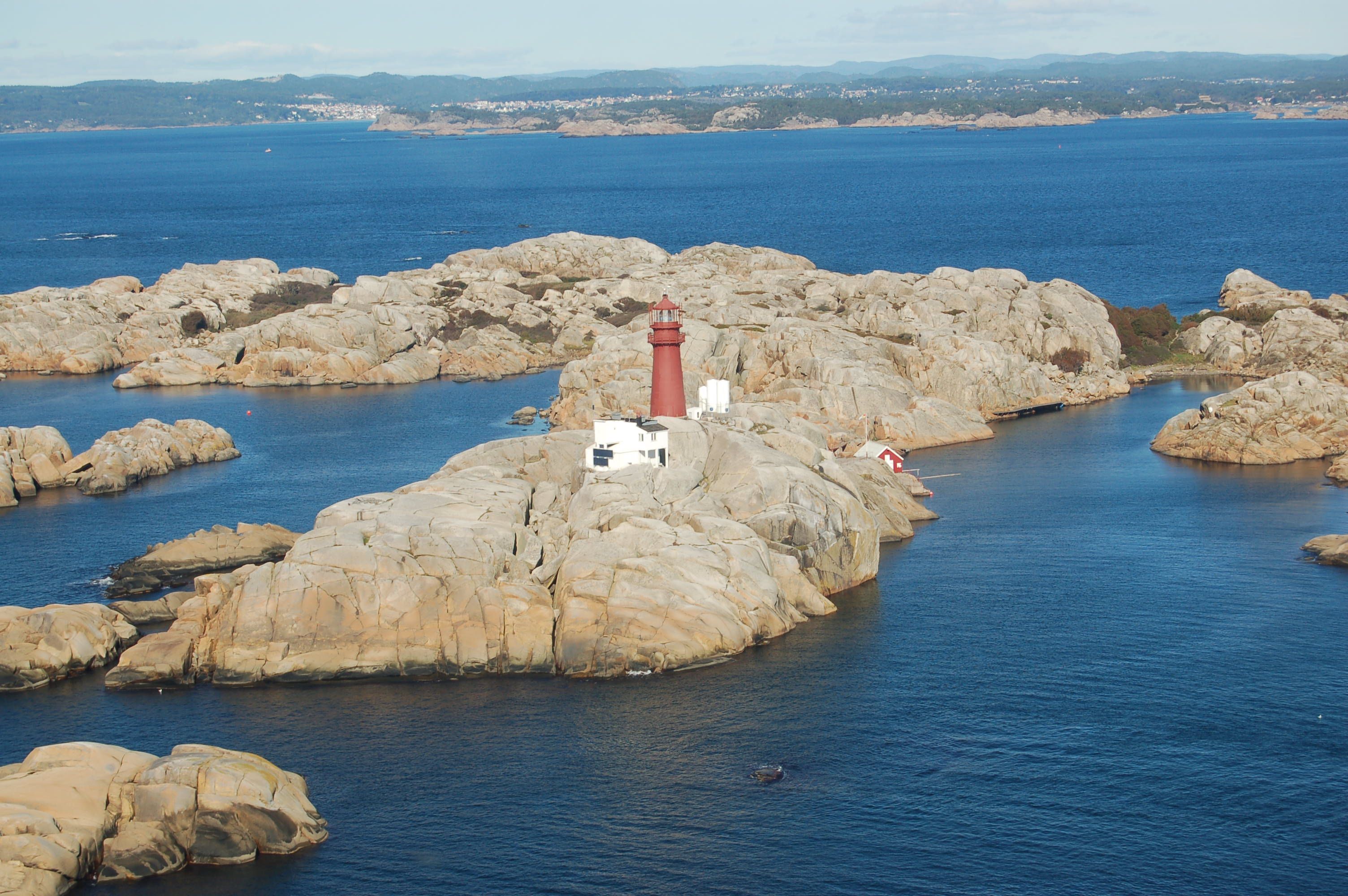 Lighthouse on mountain in the sea