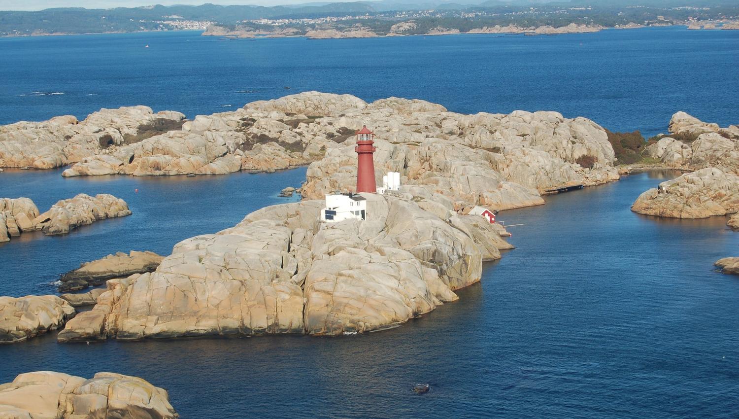 Lighthouse on mountain in the sea