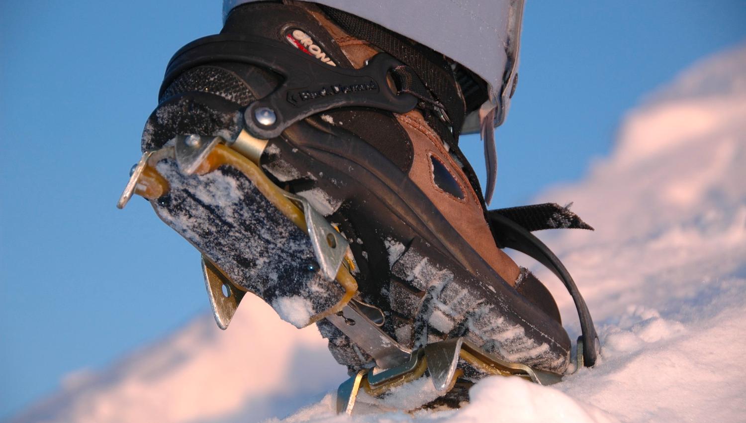 A mountain boot with crampons