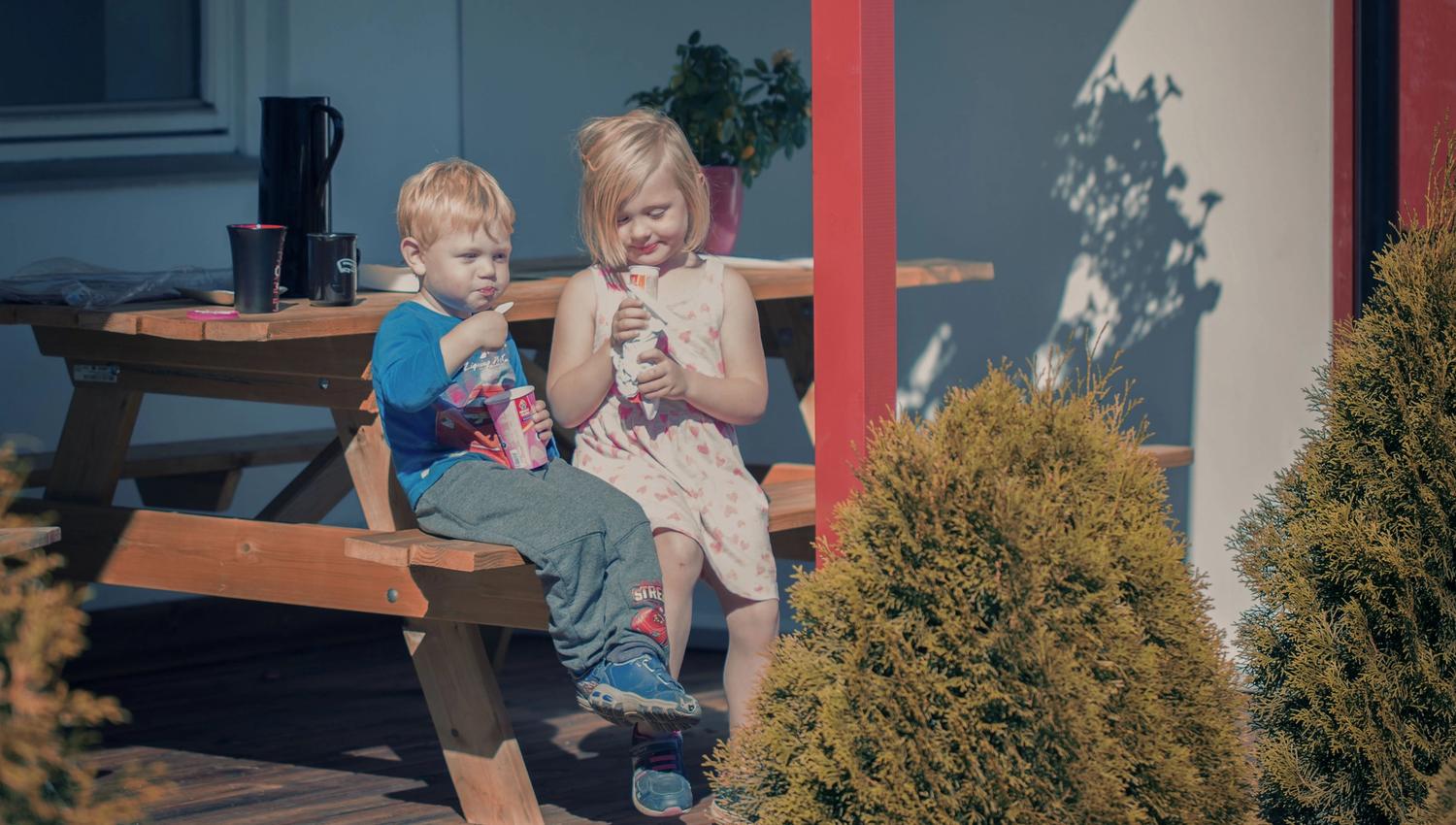 Two children eating ice cream