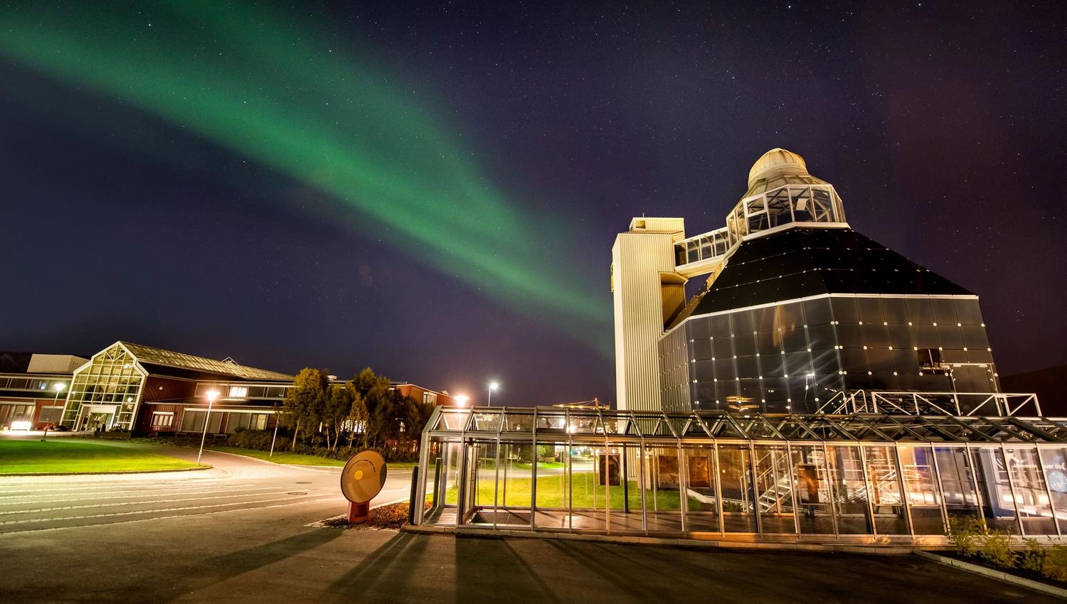 View of the Science Centre from the outside, under the Northern Lights