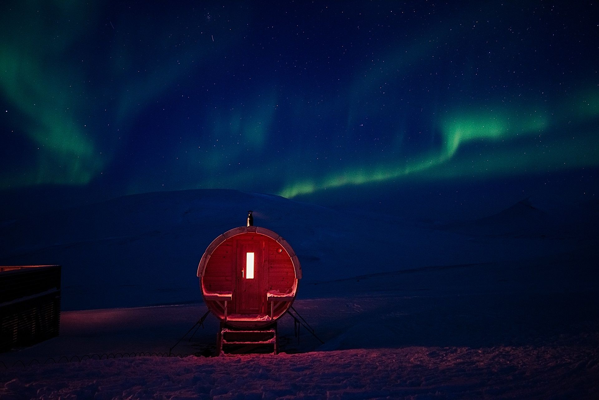 The sauna at Juva Cabin underneath the northern lights