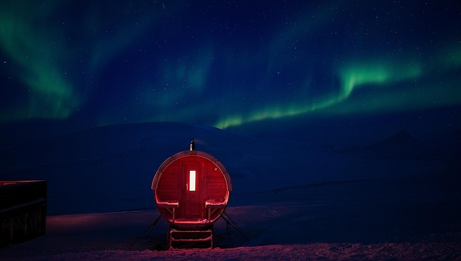The sauna at Juva Cabin underneath the northern lights