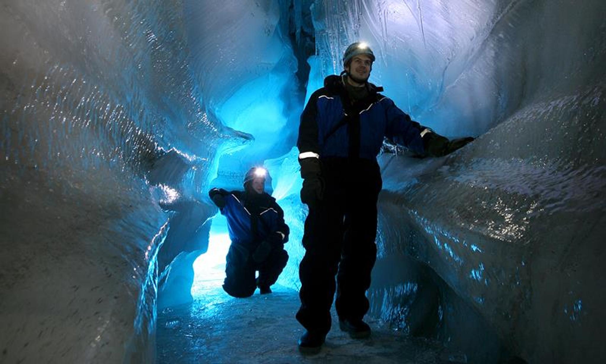 Two people in an ice cave