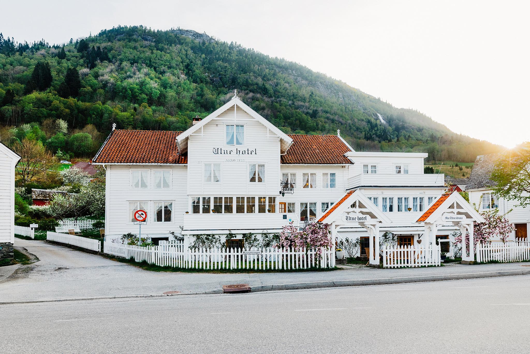 Utne Hotel – a historic wooden hotel by the fjord in Hardanger, surrounded by stunning nature.
