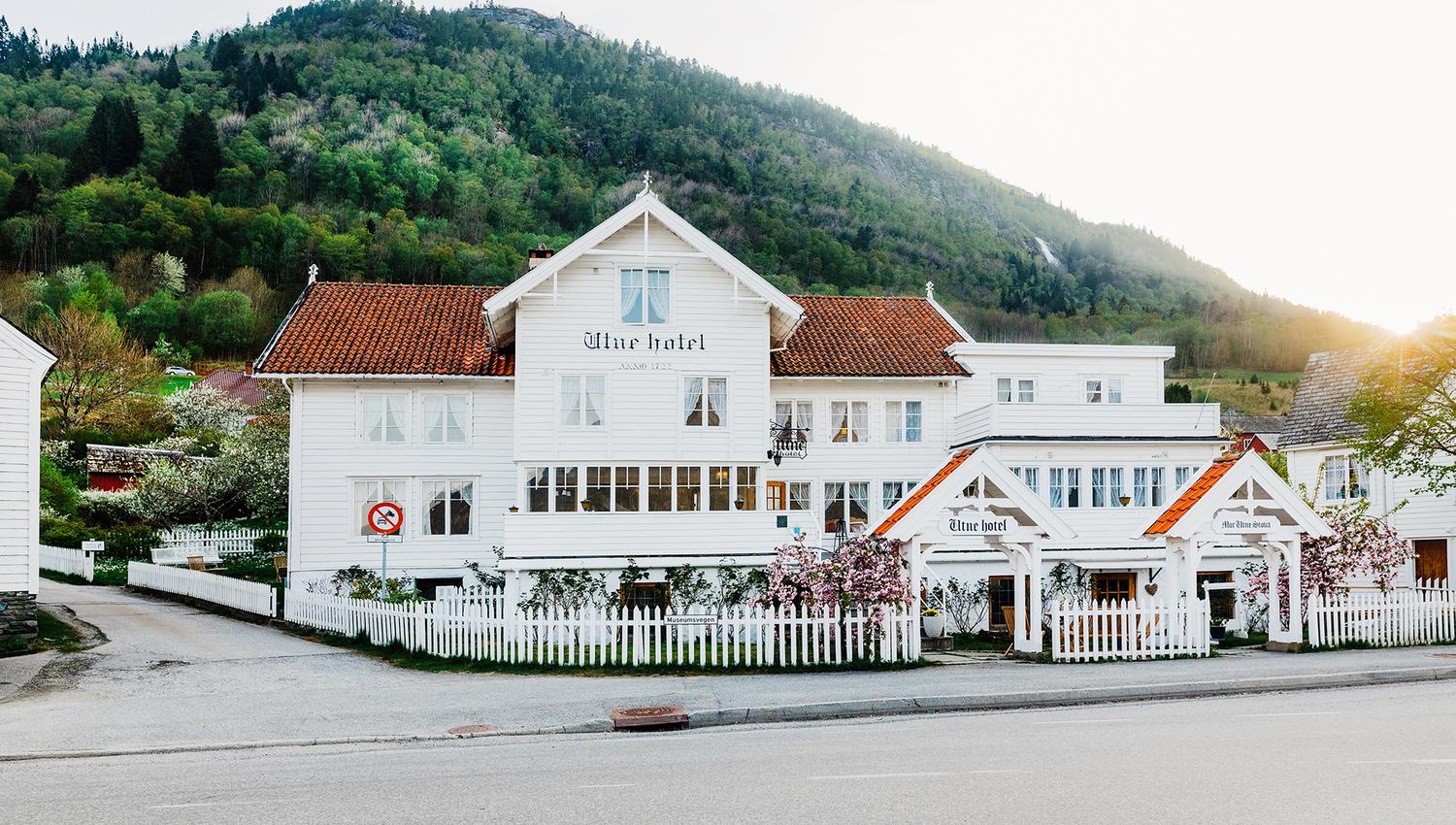 Utne Hotel – a historic wooden hotel by the fjord in Hardanger, surrounded by stunning nature.