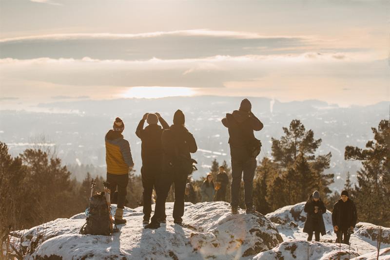 Tour group enjoying a view from the top of a mountain
