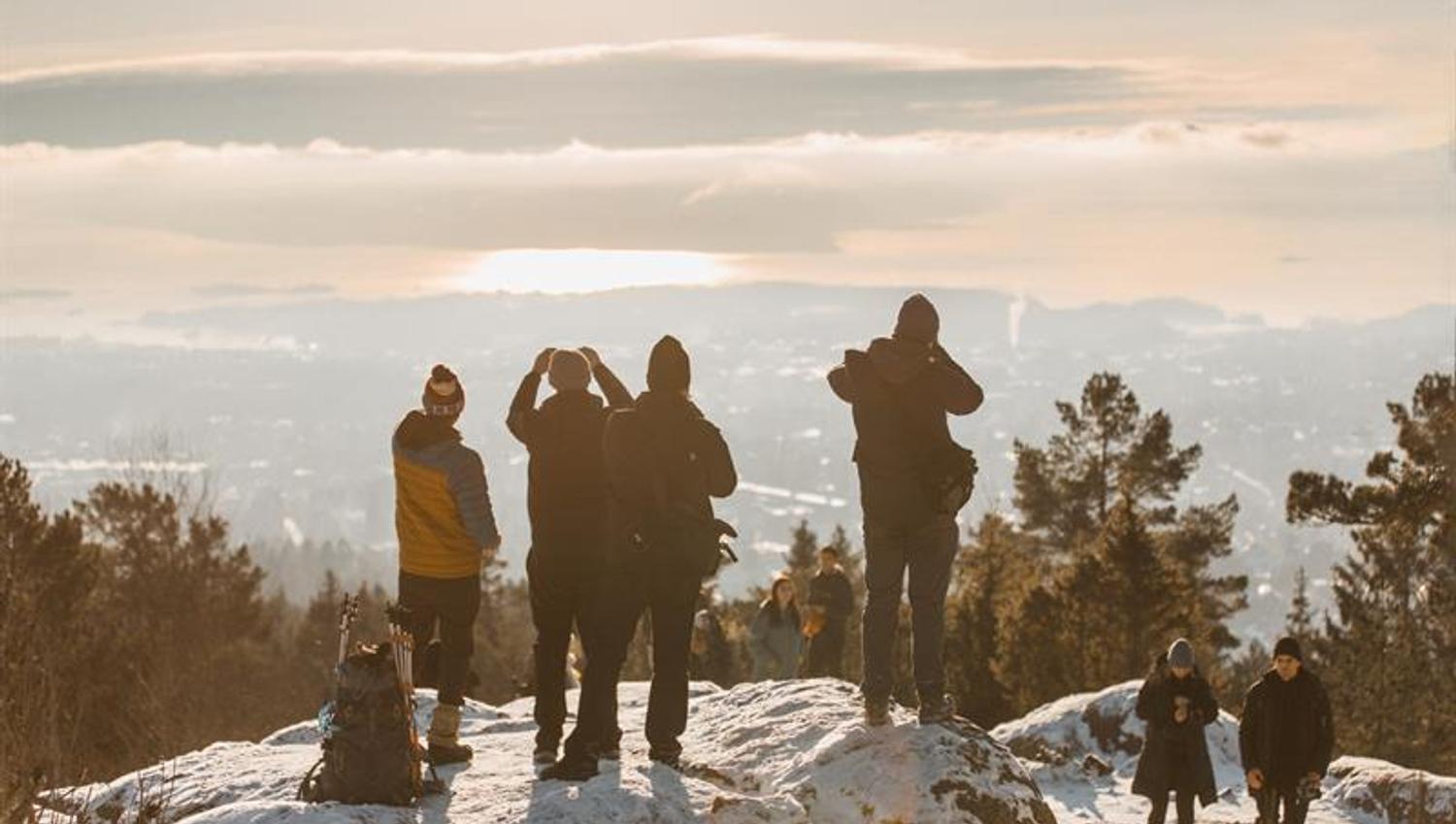 Tour group enjoying a view from the top of a mountain