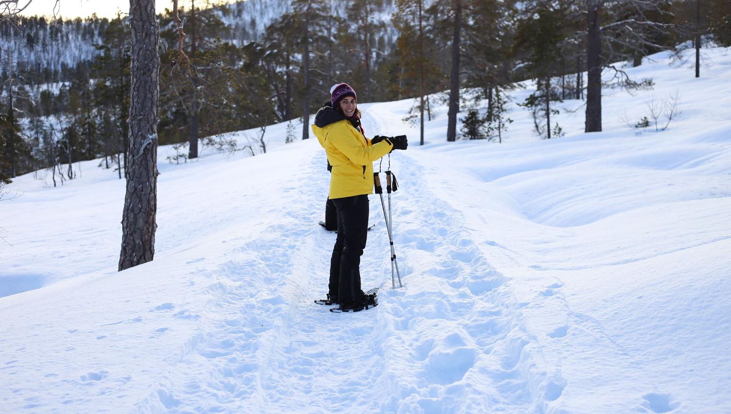 person on a snowshoe trip in a winter landscape
