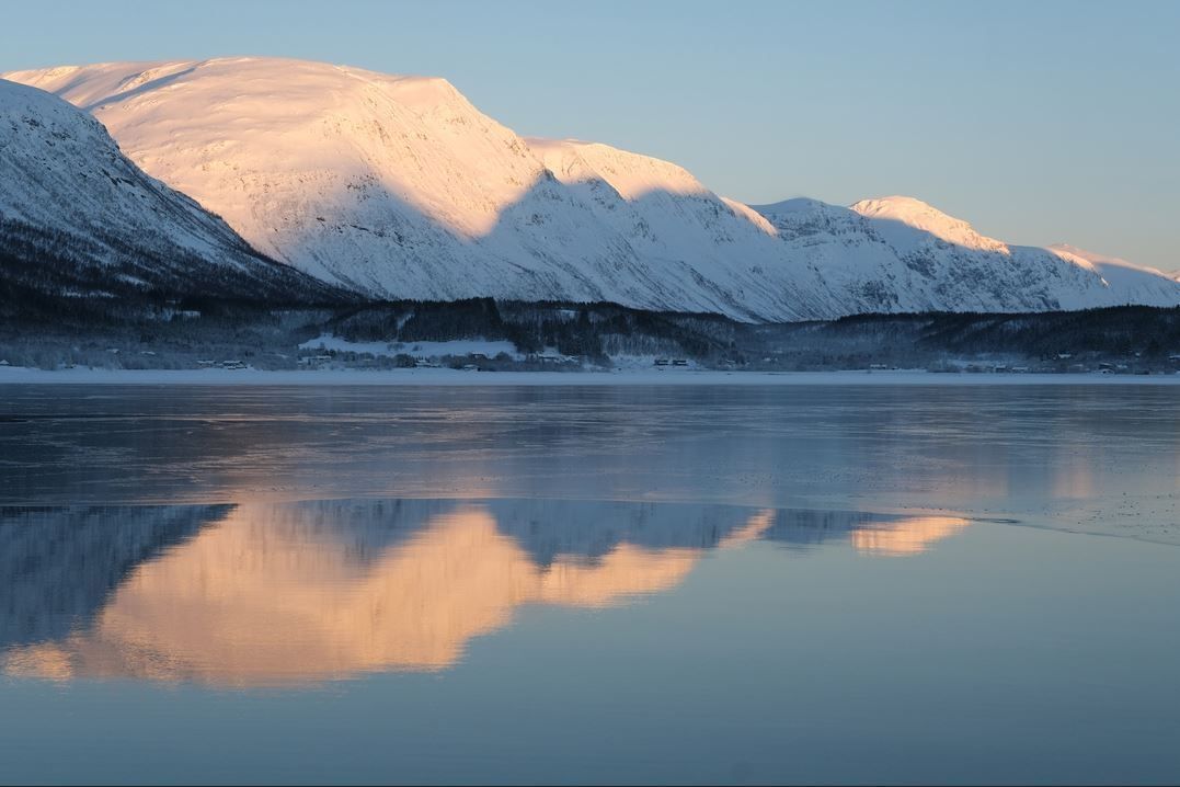 View of the fjord and snow covered mountains