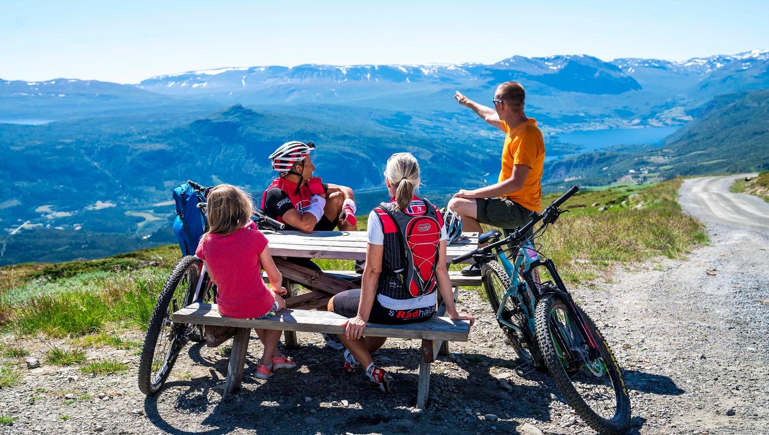 Rest at the highest point of the mountain pass road Slettefjellvegen with a breathtaking view into the valley below and mountains far behind.