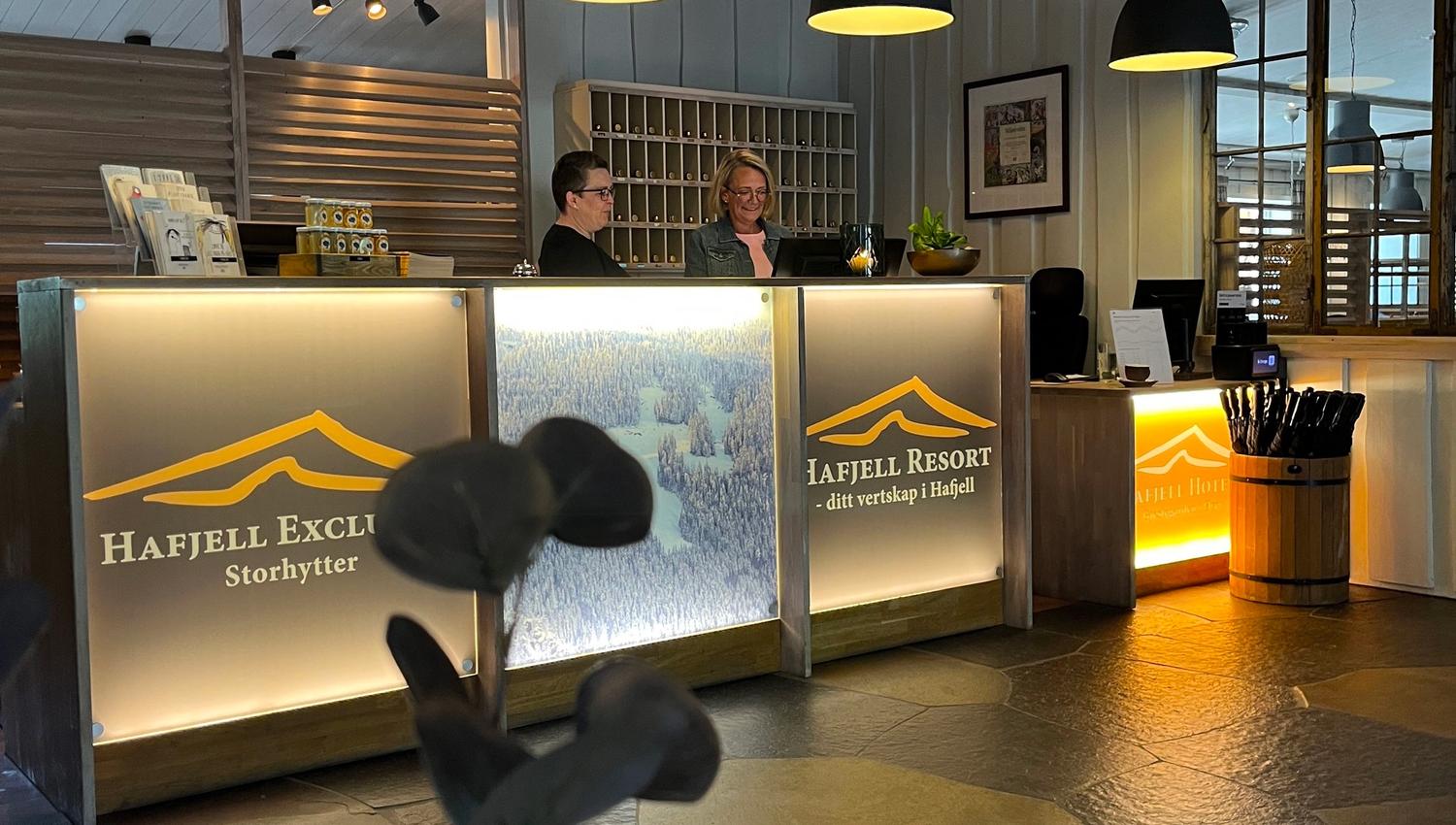 A person at a reception desk.