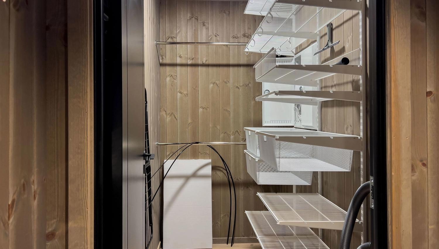 A room with shelves and a door.