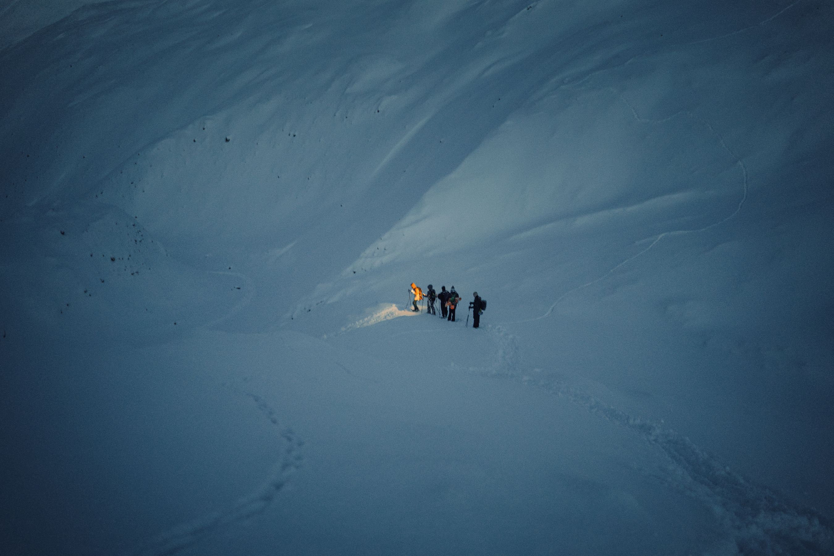 People waling on a glacier