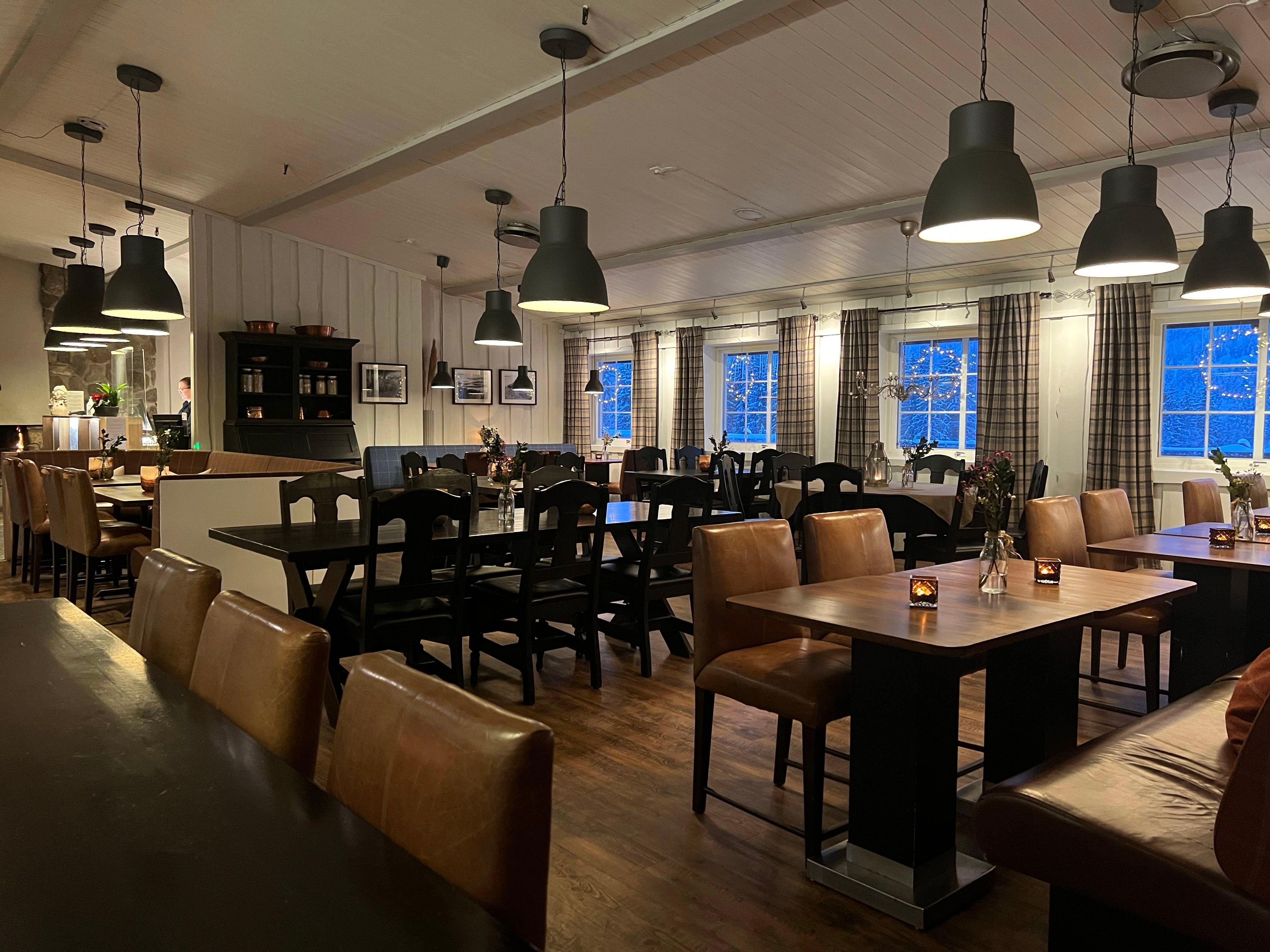 Restaurant with table and chairs.