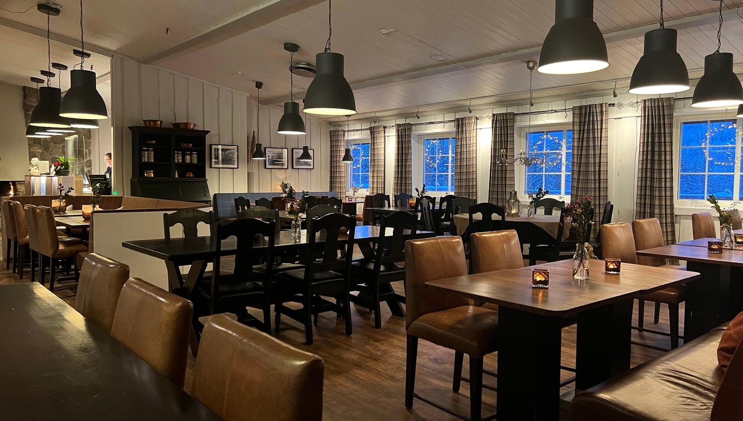 Restaurant with table and chairs.