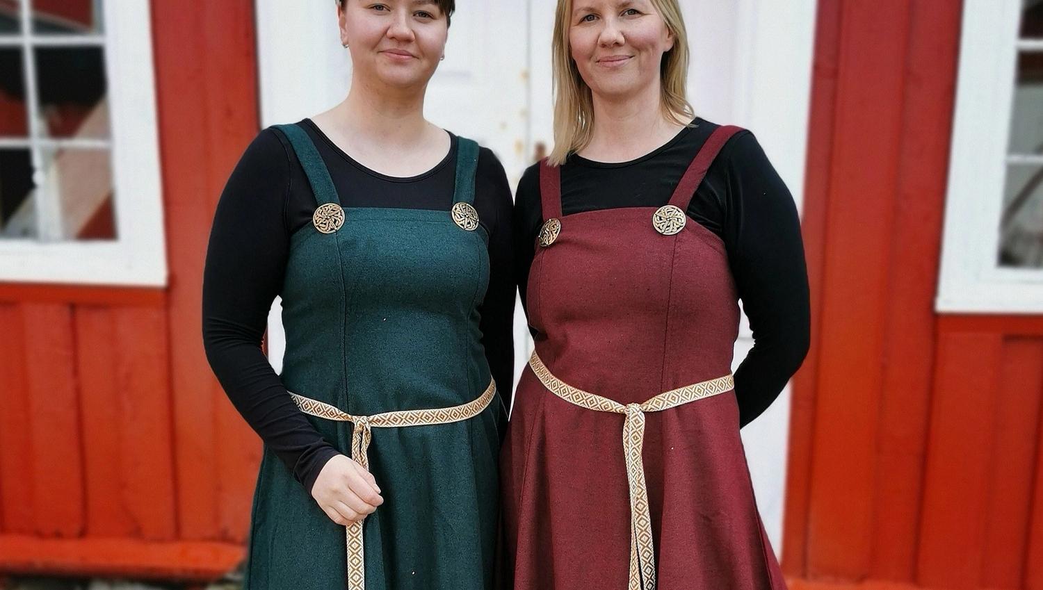 two ladies dressed in traditional clothes