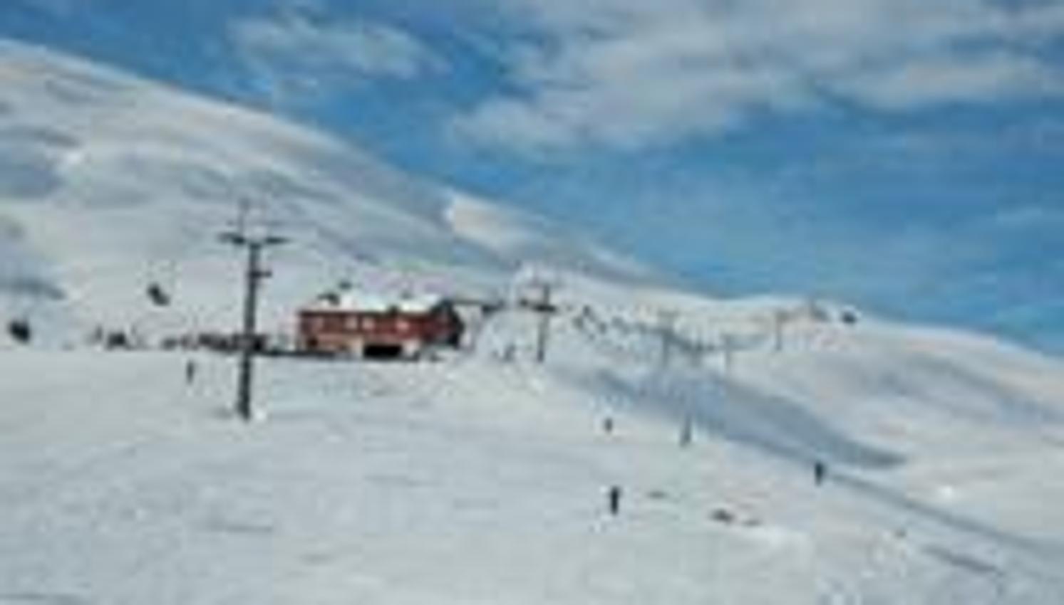 Ski joy in the sunny slopes of Røldal Ski Resort with perfect snow conditions.