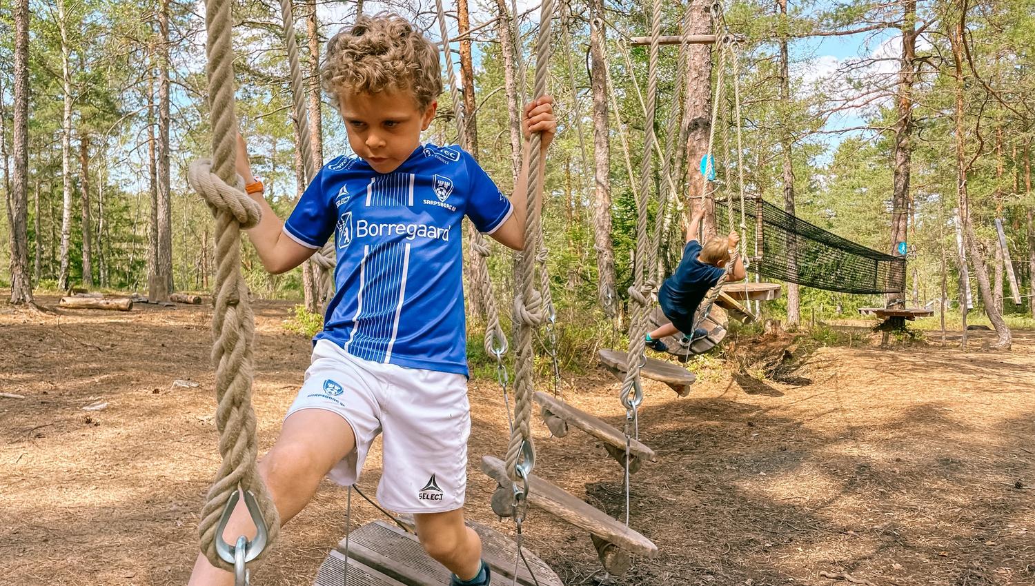 Photo, Boy trying to come through at an obstacle course