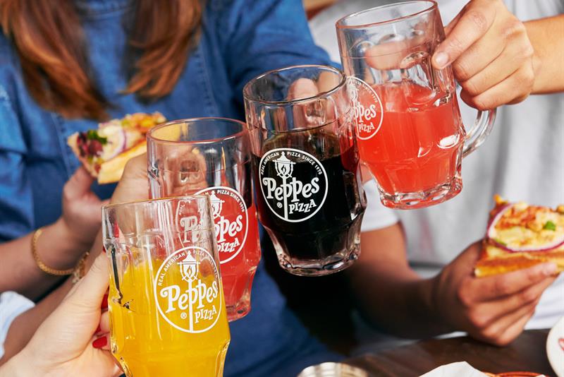 Four people toasting.