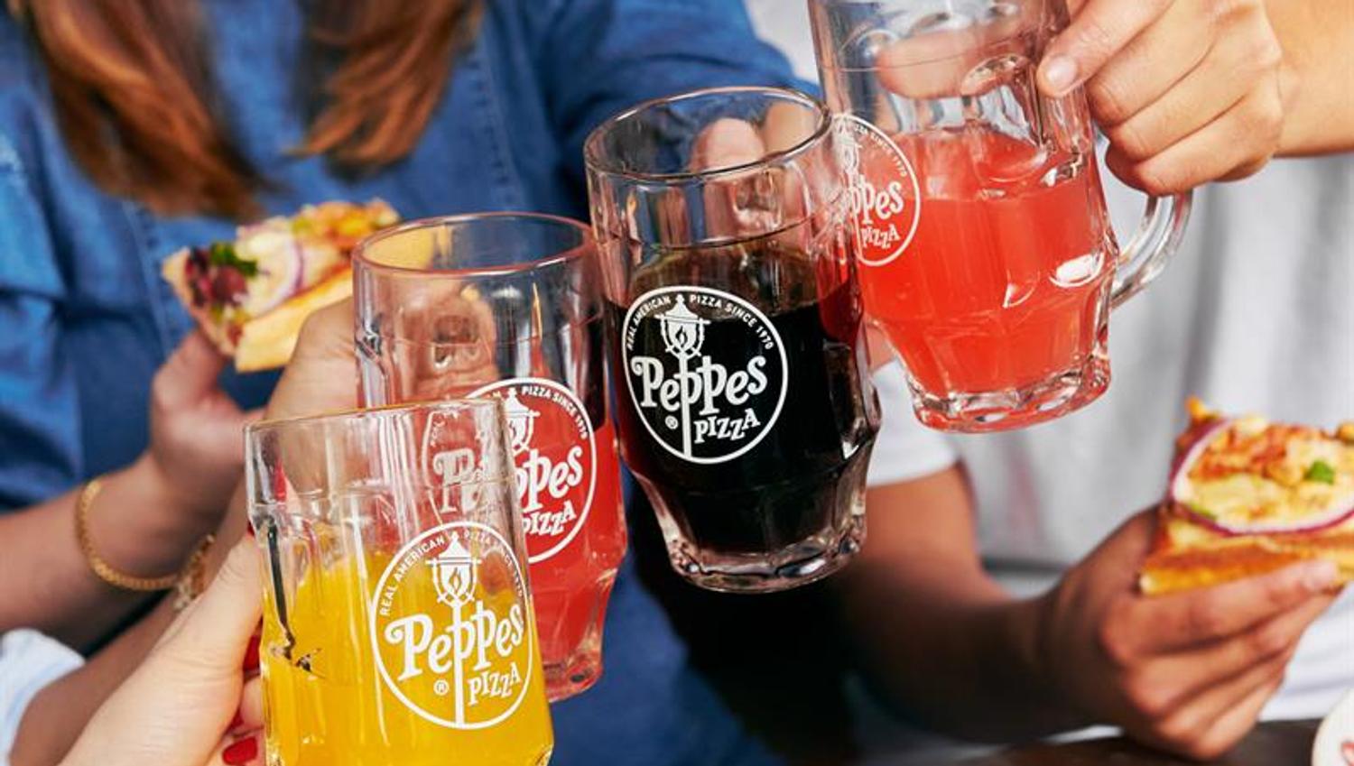 Four people toasting.