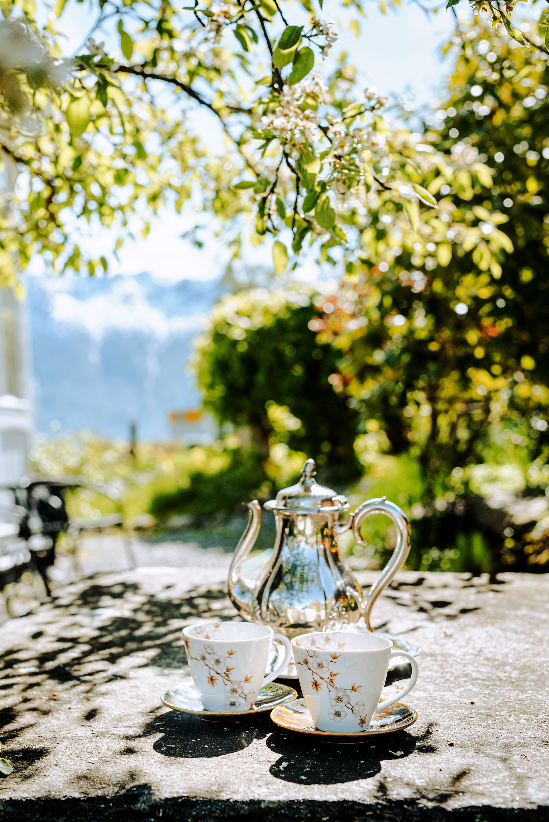 A peaceful cup of tea in the beautiful garden at Utne Hotel with a view of the fjord.
