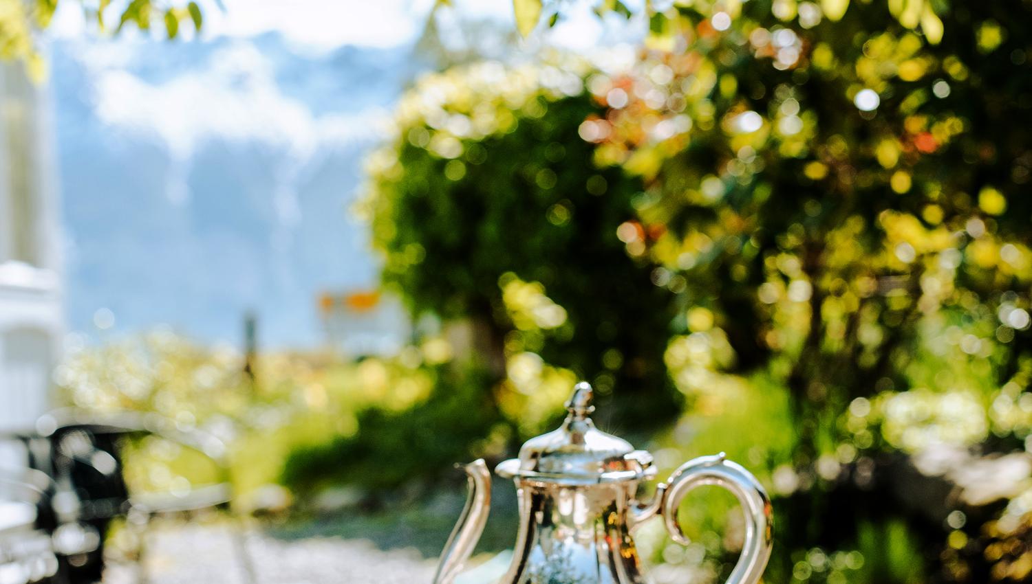 A peaceful cup of tea in the beautiful garden at Utne Hotel with a view of the fjord.