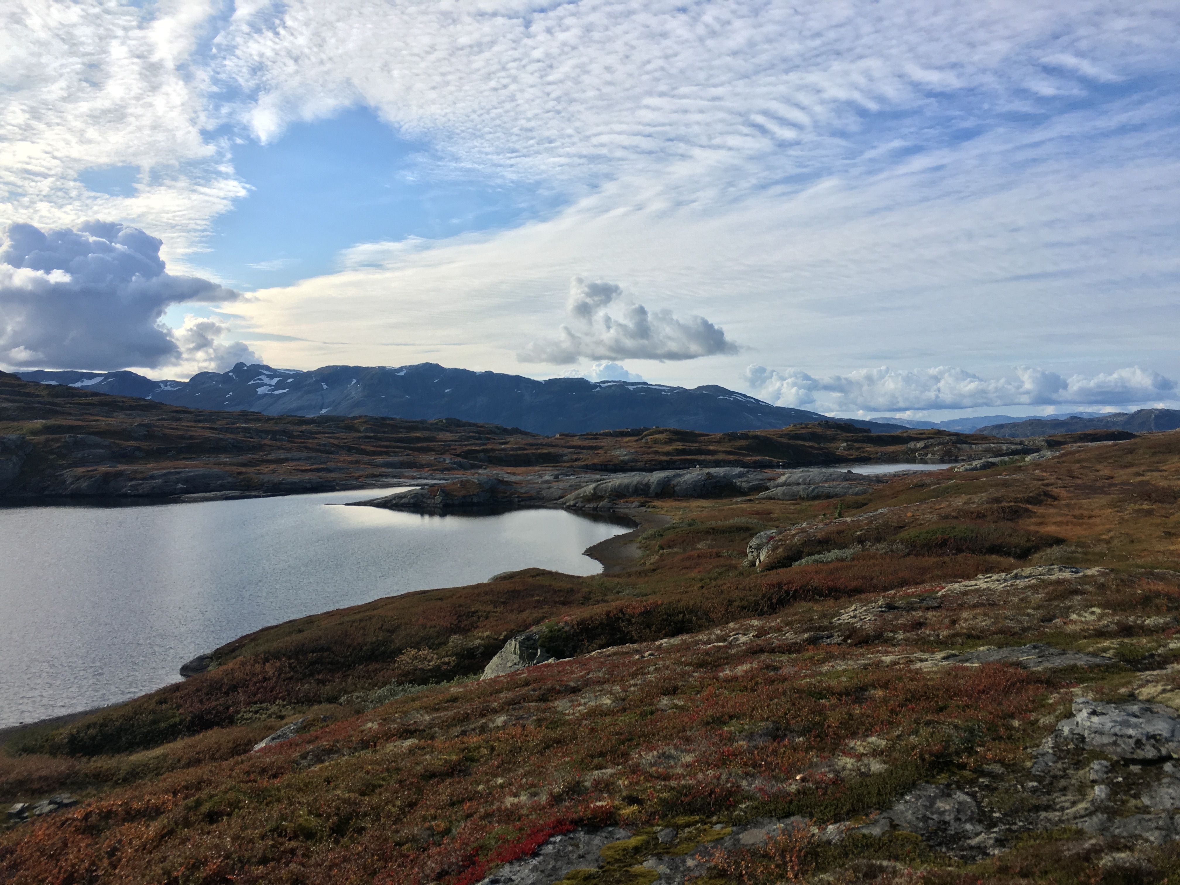 Mountain lake and open plateau with dramatic sky on Hardangervidda.