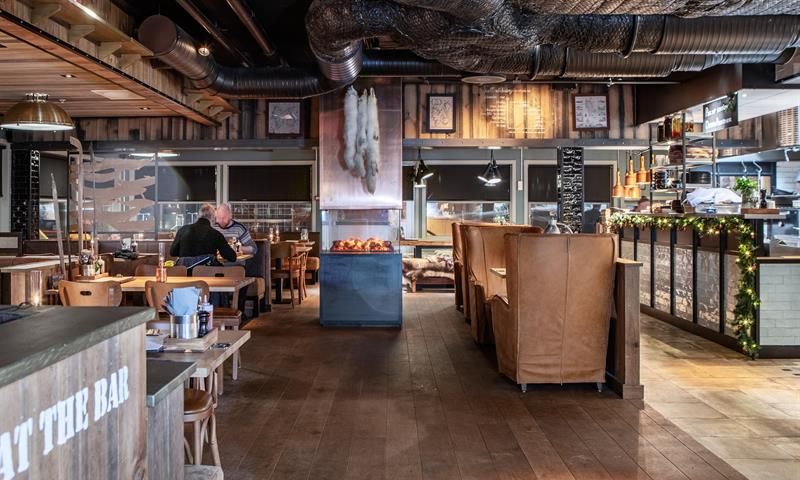 The interior and guests eating in the restaurant