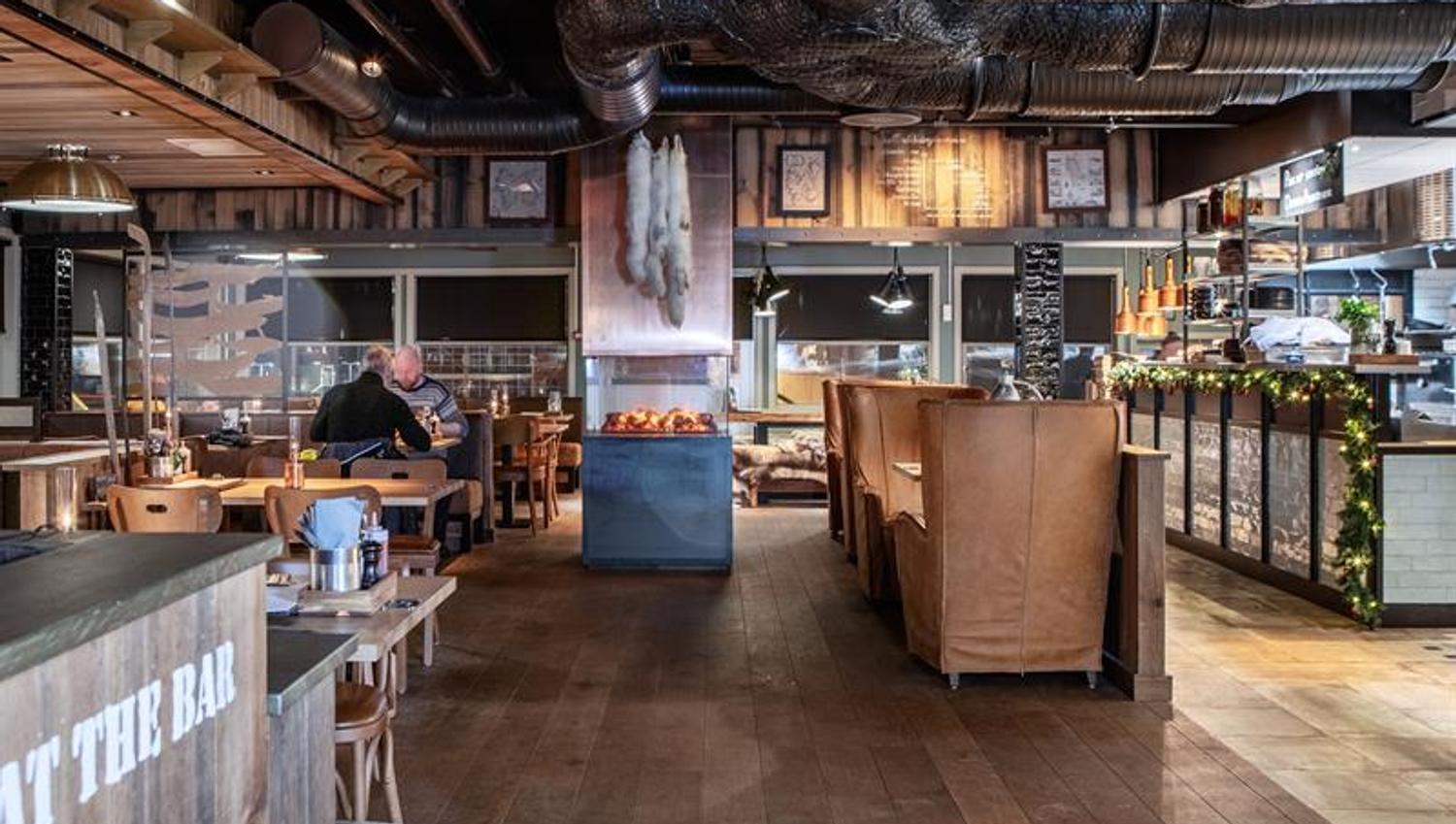 The interior and guests eating in the restaurant