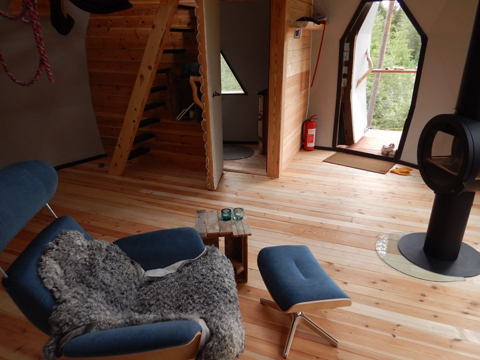 A chair in front of the wood stove