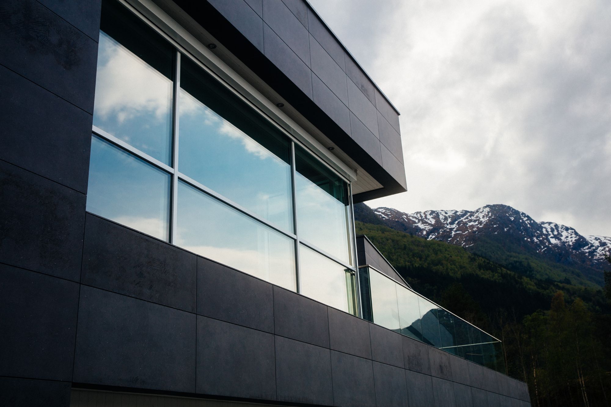 Mountain reflection on the windows of Hardanger House.