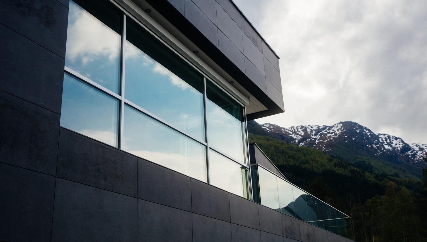 Mountain reflection on the windows of Hardanger House.