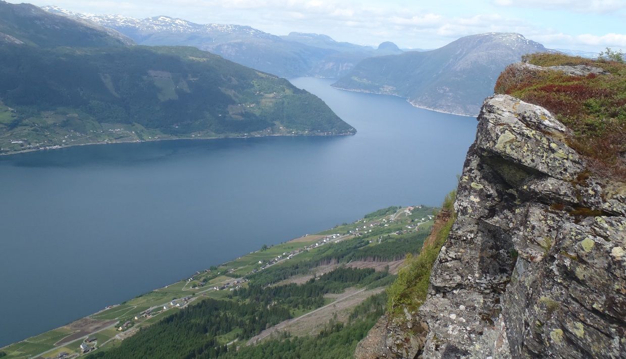 Fjord view with steep mountain sides seen from Dronningstien.