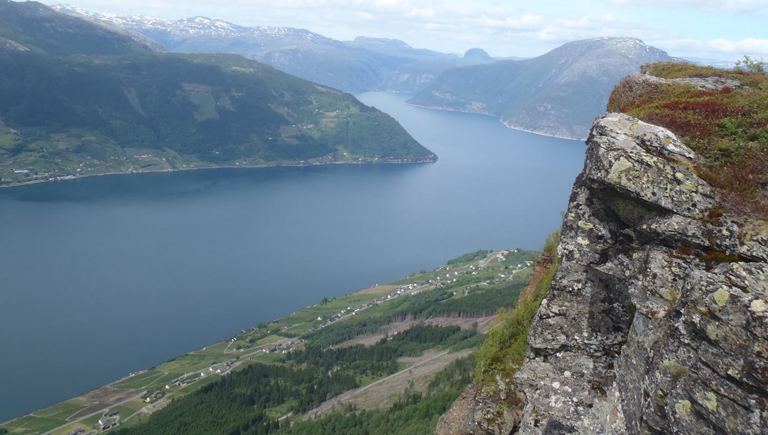 Fjord view with steep mountain sides seen from Dronningstien.