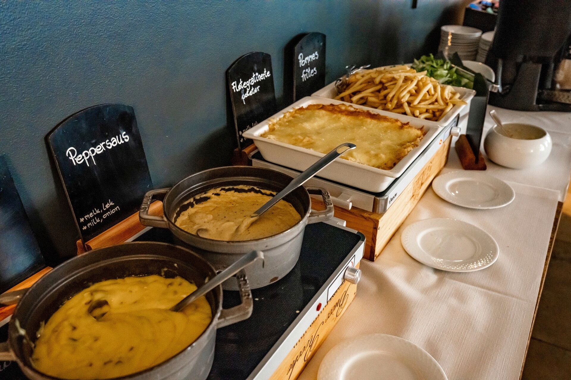 A buffet with various dishes on a table