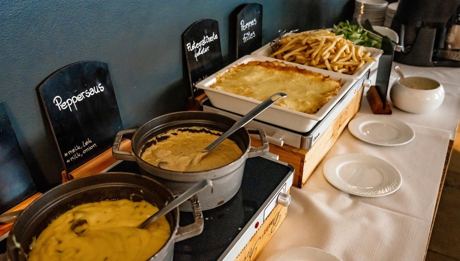 A buffet with various dishes on a table