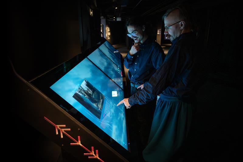 People interacting with a touch screen