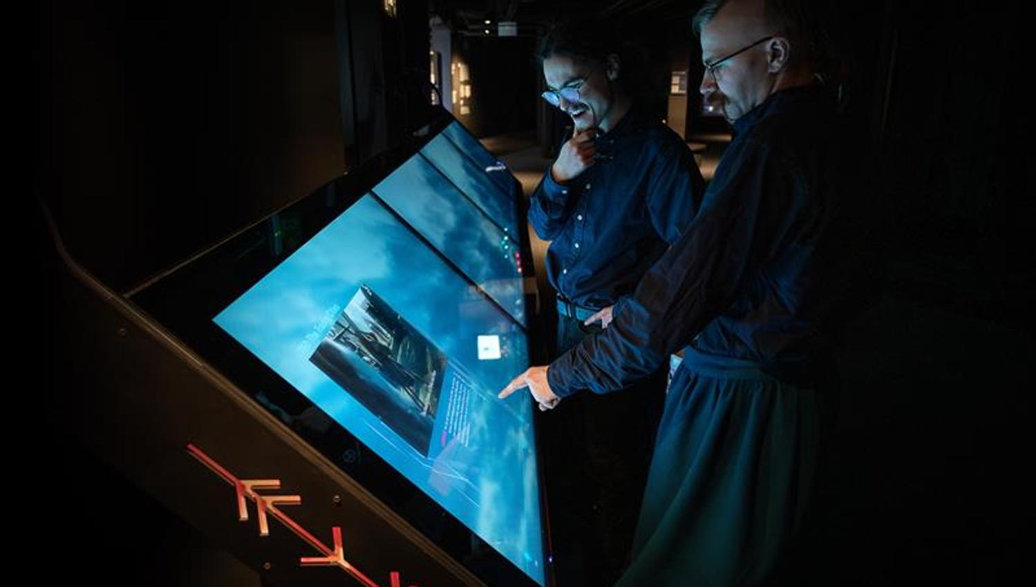 People interacting with a touch screen