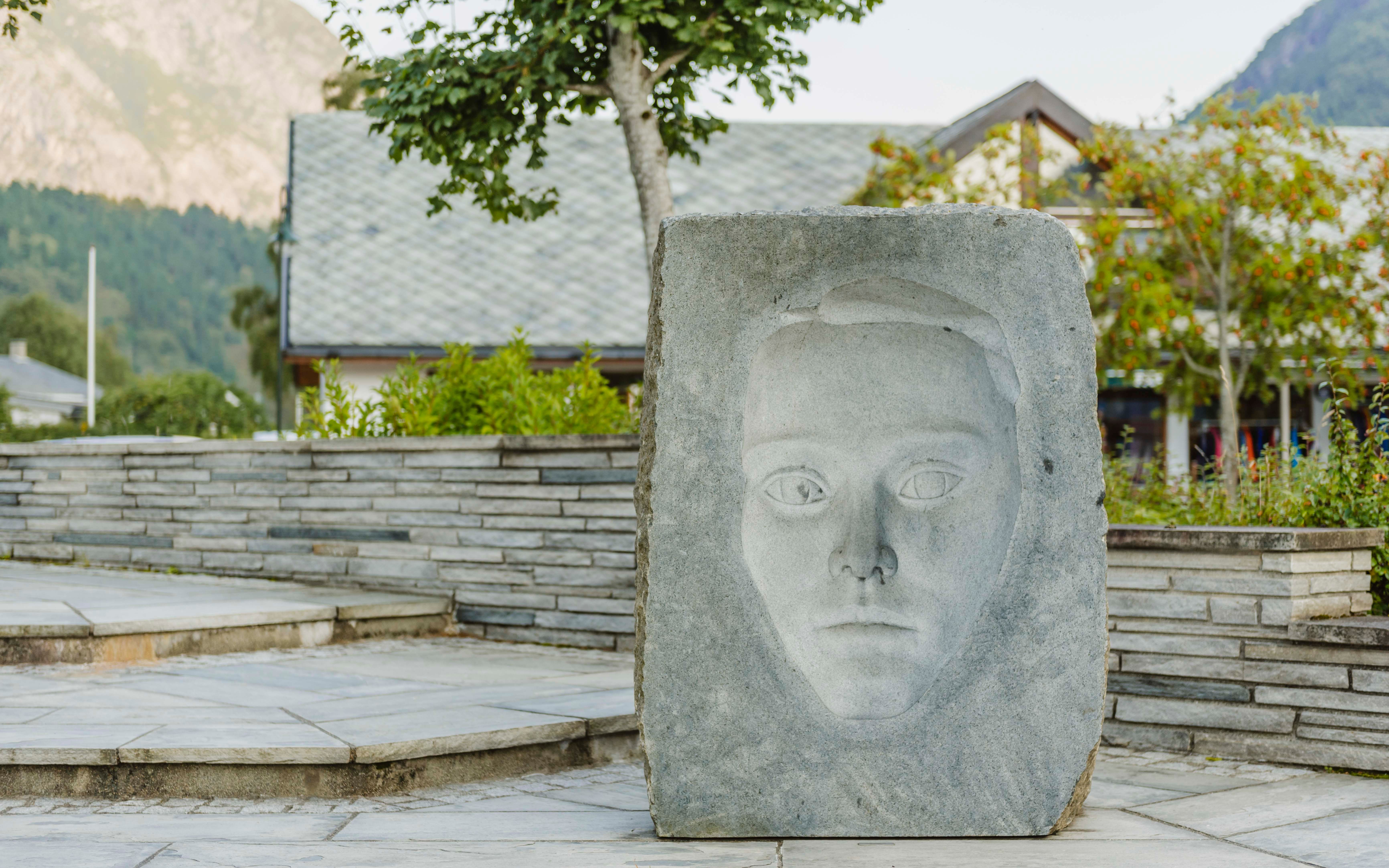 A sculpture showing a face where the eyes are watching you wherever you go.