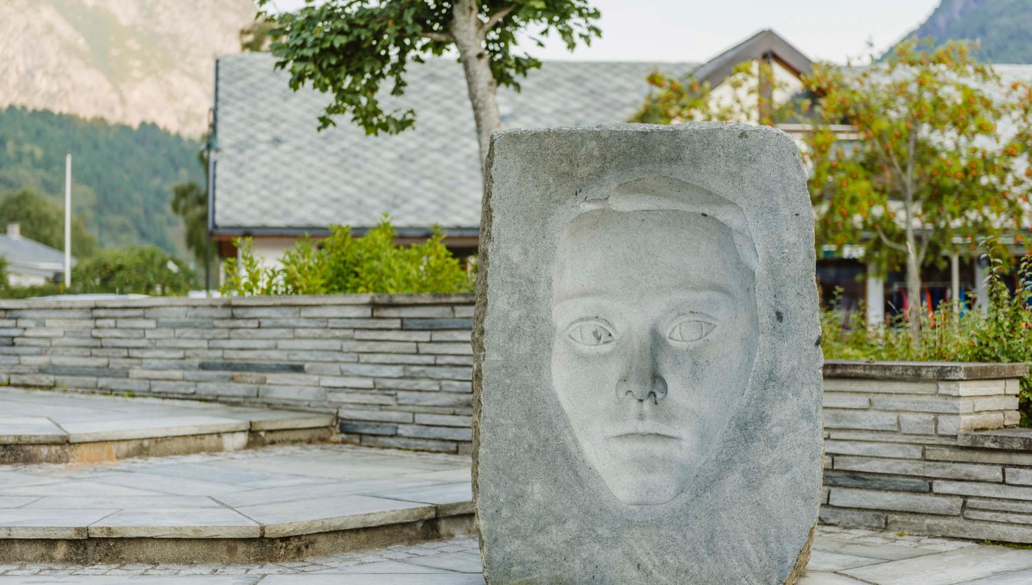 A sculpture showing a face where the eyes are watching you wherever you go.