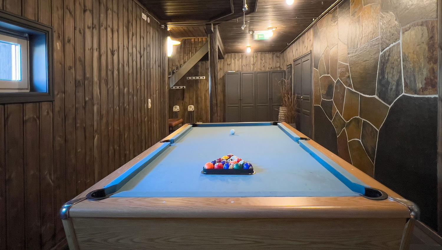 A pool table with balls on it.