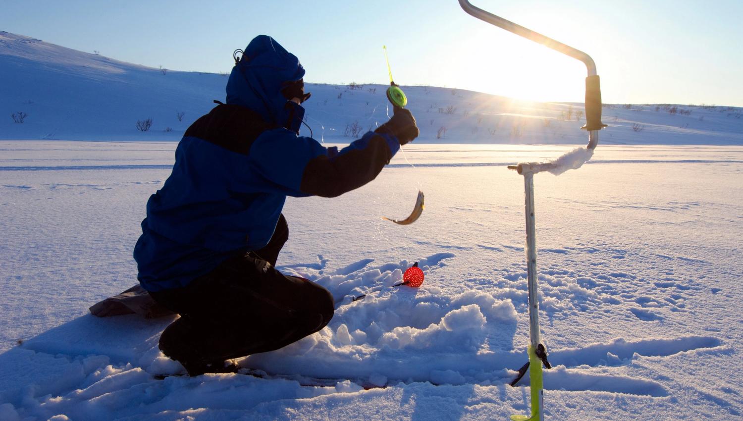 person ice fishing