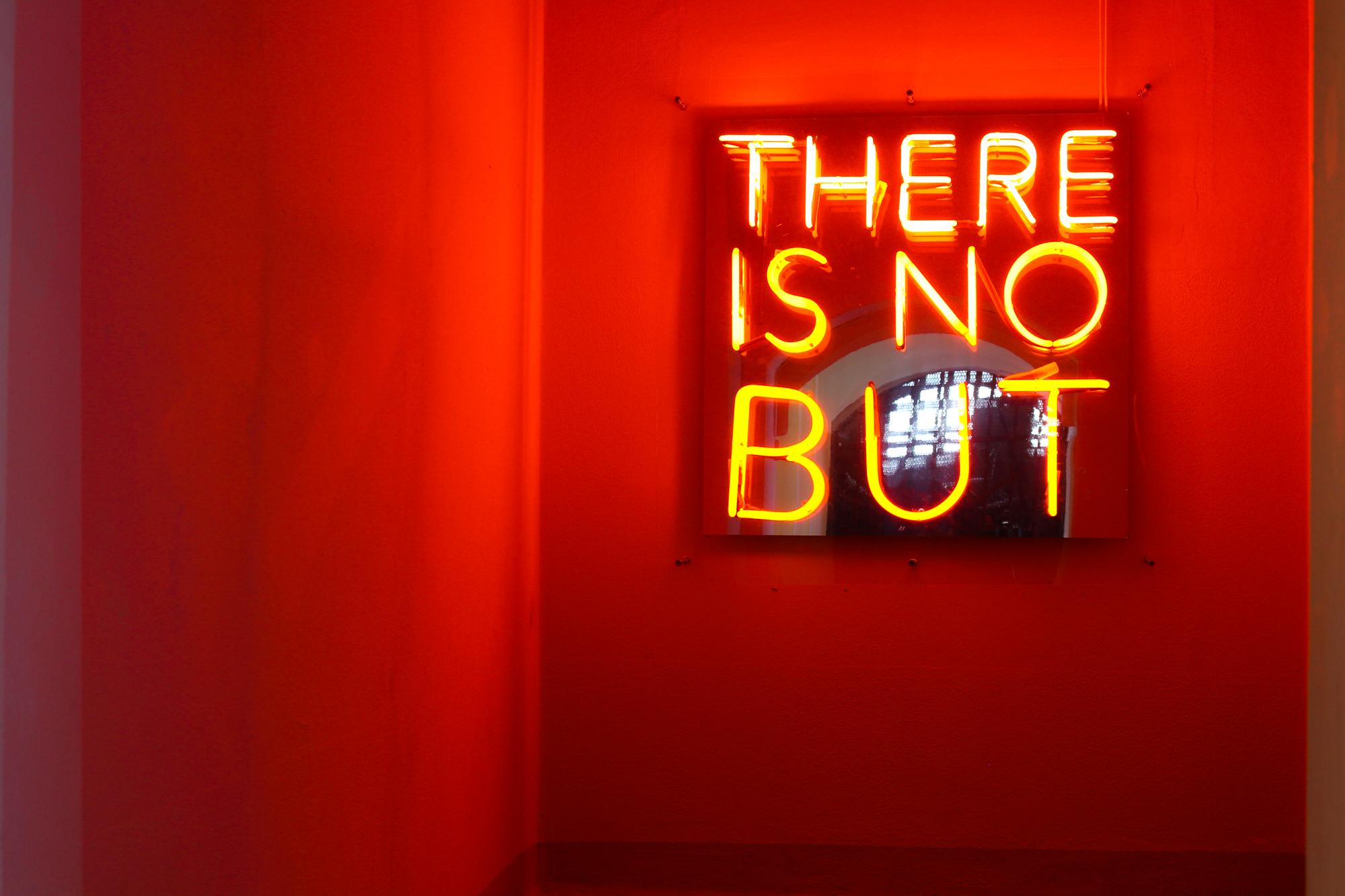 A neon sign that says: "There is no but".