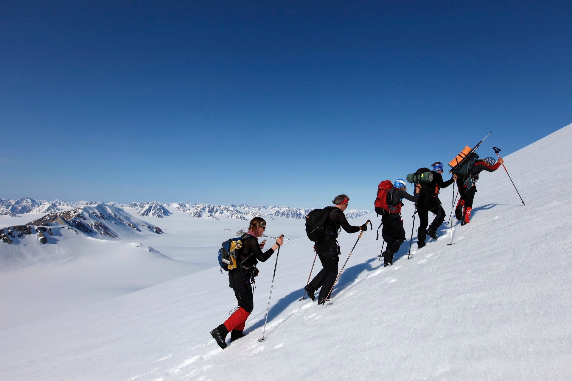 A tour group hiking up a mountain