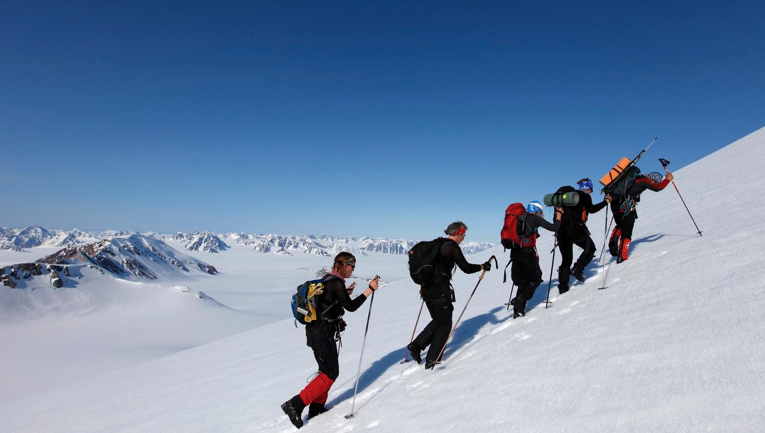 A tour group hiking up a mountain